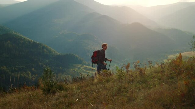 Hiking millennial enjoy picturesque nature sunrise in mountains green landscape.