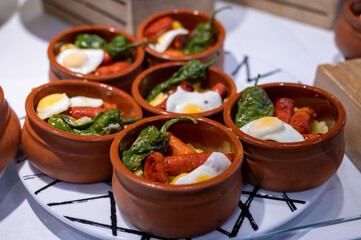 Typical snack of Basque Country and Navarre, pinchos or pinxtos served in bar, San Sebastian, Spain