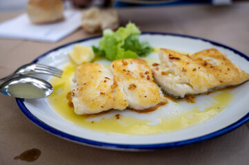 Grilled fillet of white codfish served in fish restaurant in San Sebastian, Basque Country, Spain
