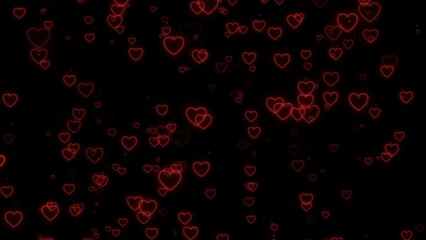 Fototapeta na wymiar Red heart shape bokeh effect on black background. Valentine's day backgroud. 