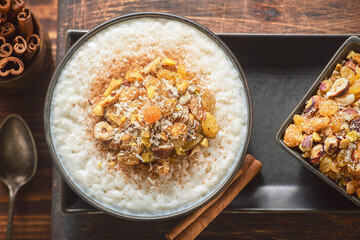 Arabic Cuisine; Middle Eastern  delicious creamy Rice Pudding topped with cinnamon and nuts.