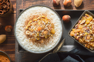 Arabic Cuisine; Middle Eastern  delicious creamy Rice Pudding topped with cinnamon and nuts.