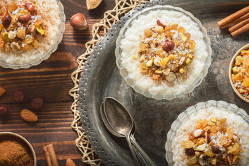 Arabic Cuisine; Middle Eastern  delicious creamy Rice Pudding topped with cinnamon and nuts.