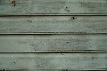 Fototapeta premium Texture of an old fence made of wooden boards close-up
