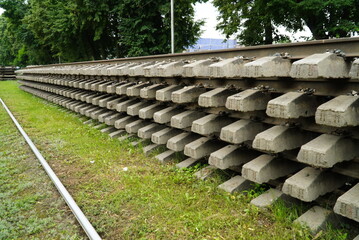 Obraz premium Old rails and sleepers. The rails and sleepers are stacked on each other. Renovation of the railway.