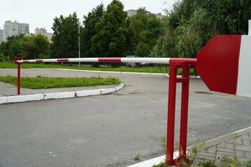 On the asphalt road leading to the recreation area, installed metal barrier. On the sides of the...