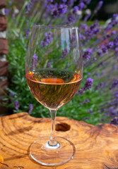French rose wine from Provence, two glasses of wine with purple lavender flowers on background