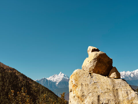 Huge Prayer Stone With Meili Snow Mountain In Background In China's Sichuan Province