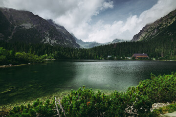 Fototapeta premium Amazing view of mountains and Poprad Lake (Popradske pleso) in High Tatras National Park. Slovakia. Europe. Mountain hiking. Concept of travel lifestyle, harmony with nature. Nature background.