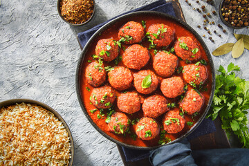 Middle Eastern traditional spiced meatballs in tomato sauce 