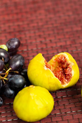 red and yellow fig with grape