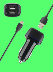 power adapter for the phone from the cigarette lighter, on a green background