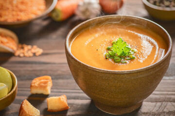 Arabic Cuisine; Middle Eastern traditional red lentil soup served with fresh lemons and crispy croutons. 