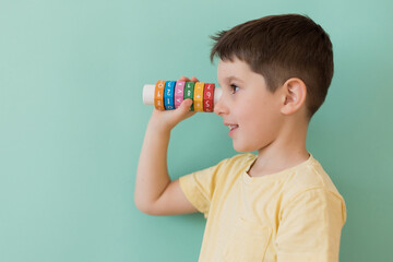 Boy with arithmetic math learning toy - obrazy, fototapety, plakaty