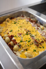metal tray with different sauces from a food buffet