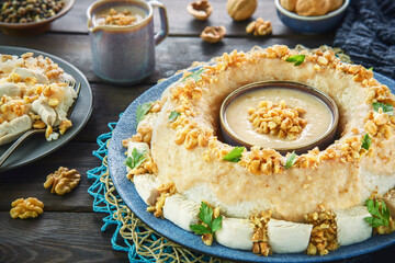 Arabic Cuisine: Circassian Chicken or Chicken Sharkaseya. It is a very old Turkish recipe which has been adapted by Egyptian cuisine. It consisting of chicken, white rice and creamy walnut sauce.
