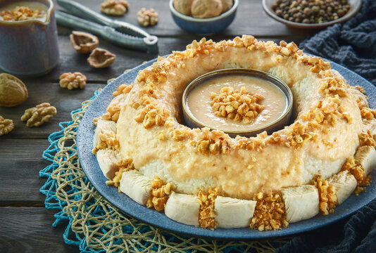 Arabic Cuisine: Circassian Chicken or Chicken Sharkaseya. It is a very old Turkish recipe which has been adapted by Egyptian cuisine. It consisting of chicken, white rice and creamy walnut sauce.
