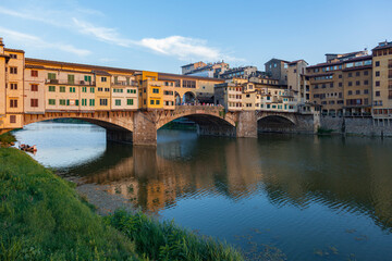 Fototapeta na wymiar Ponte Vecchio in Florence with reflection in the water