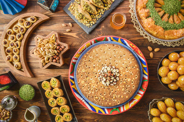 Arabic Cuisine: Middle Eastern desserts. Delicious collection of Ramadan traditional desserts. Served with tasty nuts, honey syrup and sugar syrup .Top view with close up.
