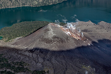 Smoking volcano at the top of Mount Rinjani, Indonesia. Unreal. Volcano. Eruption © john