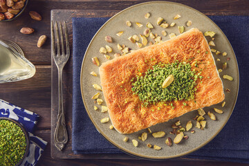 Arabic Cuisine; Traditional Middle Eastern Cheese Kunafa Dessert. A delicious pastry consisting of...