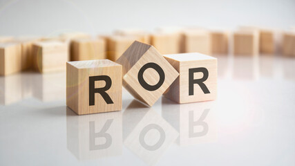 ROR - return on assets shot form on wooden block