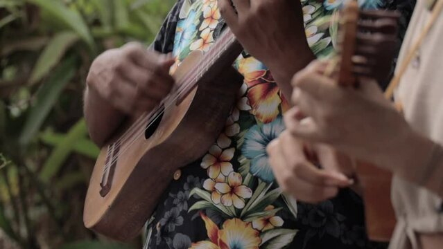 Closeup of hands playing duo on the Uku
lele