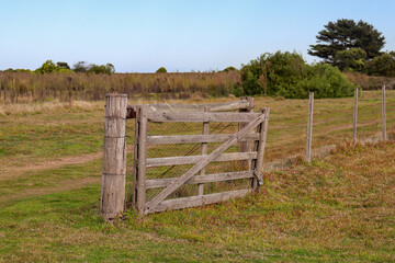 old wooden gate in the field