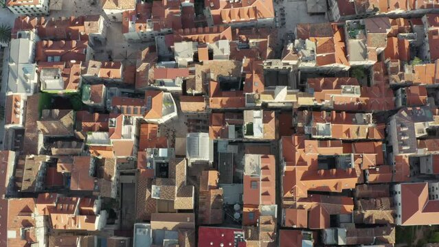 Aerial view Split Croatia. Old houses and streets in the historic center of the city, red roofs of houses, roads on which cars drive. High quality 4k footage