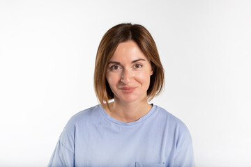 Portrait of young attractive woman smiling on a camera isolated on white background