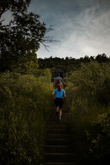 woman running on a mountain path