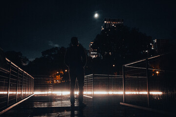 person silhouette at night