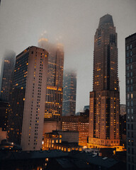 city skyline on foggy night