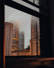 city skyline on foggy night