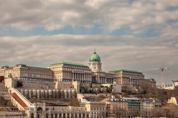 Budapest Buda Castle seen from Pest with the budavar palace in front.  The castle is the historical palace complex of the Hungarian kings and a landmark of Budapest, Hungary....