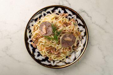 Beshbarmakwith beef and kazi, Uzbek kitchen top view