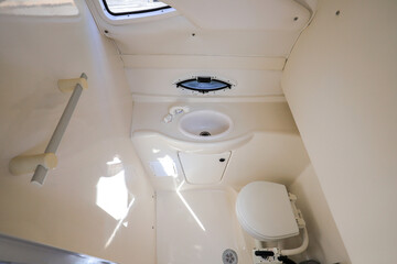 Interior restroom toilet inside motor yacht