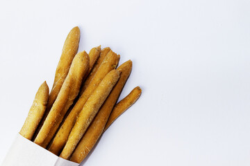 Italian grissini in a napkin on a white background
