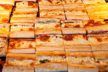 Pide; in English “flatbread” with ground beef and vegetable fillings on top, is a delicious and popular fast food of Turkish Cuisine.