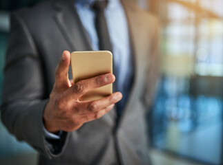 Business, phone and hand of a professional man typing a message, browsing online and using a mobile...