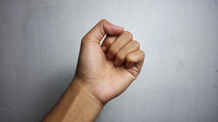 Hand clenched sign isolated on white background 