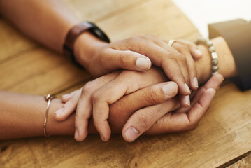 The value of kindness is immeasurable. Closeup shot of two unrecognizable people holding hands in...
