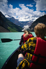 couple in the mountain lake louise banff canada
