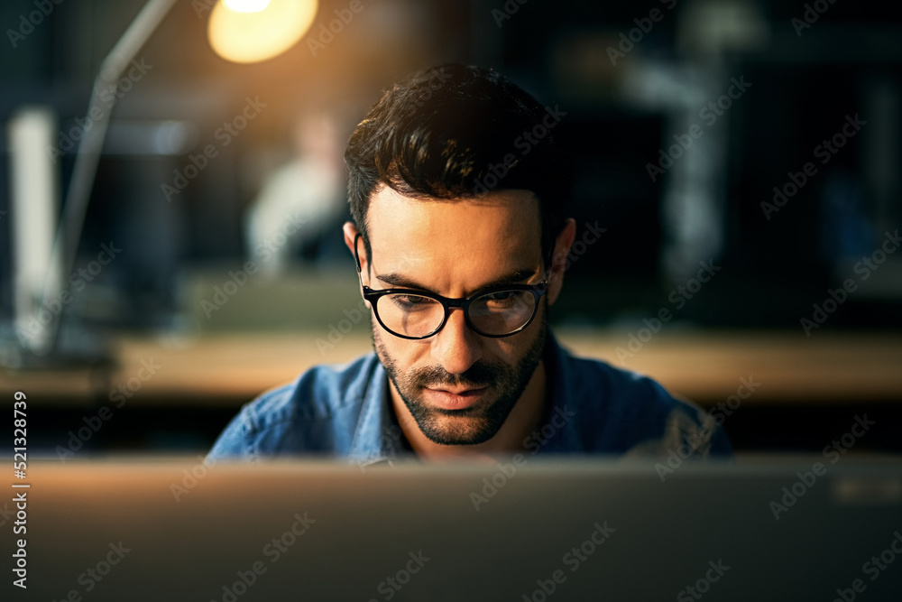Aufkleber it guy working with computer late at night, searching online while planning, thinking strategy or ty