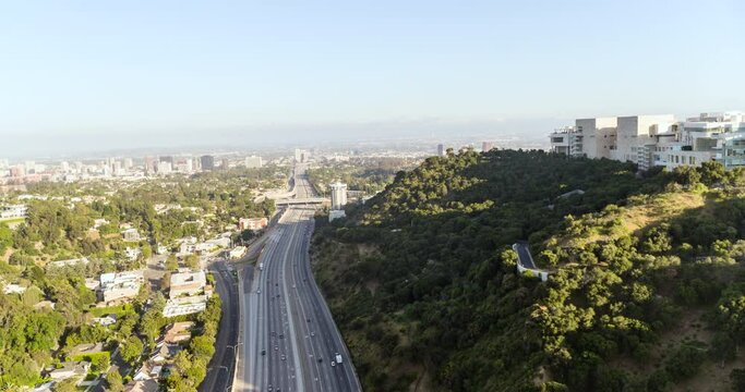 Aerial Reversing Over The Freeway And The Getty Research Institute Hillside Campus - Los Angeles, California