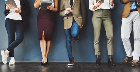 Connected, communication and network of diverse businesspeople using multimedia technology, waiting for an interview. Professional group standing in a row, browsing social media with online apps - obrazy, fototapety, plakaty