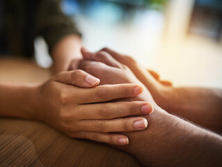 Holding hands showing care, love and support between friends, couple or family. People comforting, giving affection and consoling with a hand gesture and touch for compassion, empathy and kindness - obrazy, fototapety, plakaty