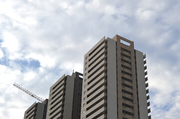 gray multi-story building in focus from below
