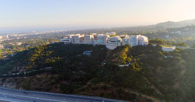 Aerial Circling The Massive Getty Research Institute Hillside Campus With A Busy Freeway In The Foreground - Los Angeles, California