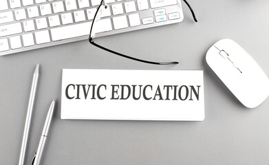 CIVIC EDUCATION text on paper with keyboard on grey background